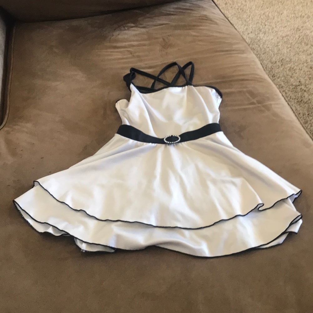 Shiny small dress with gems the middle.